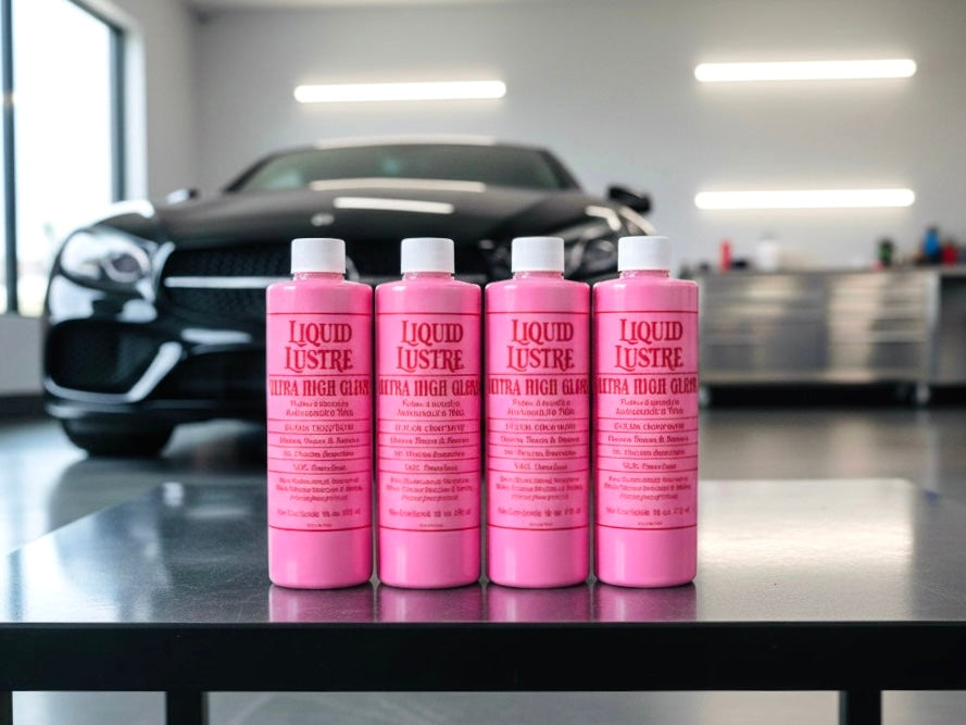 Four bottles of The Liquid Lustre Original pink  wax on a counter in a high end garage 